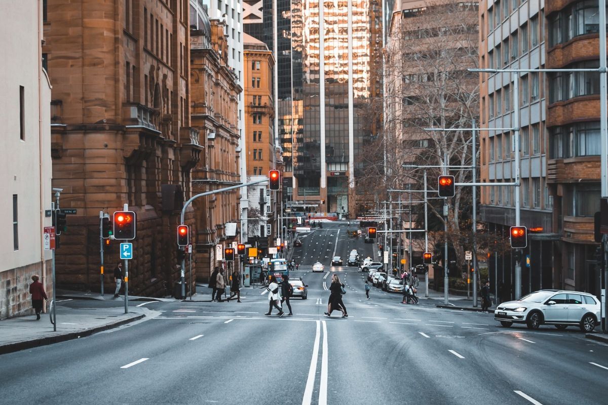 A city street with marked pedestrian crossings and traffic
