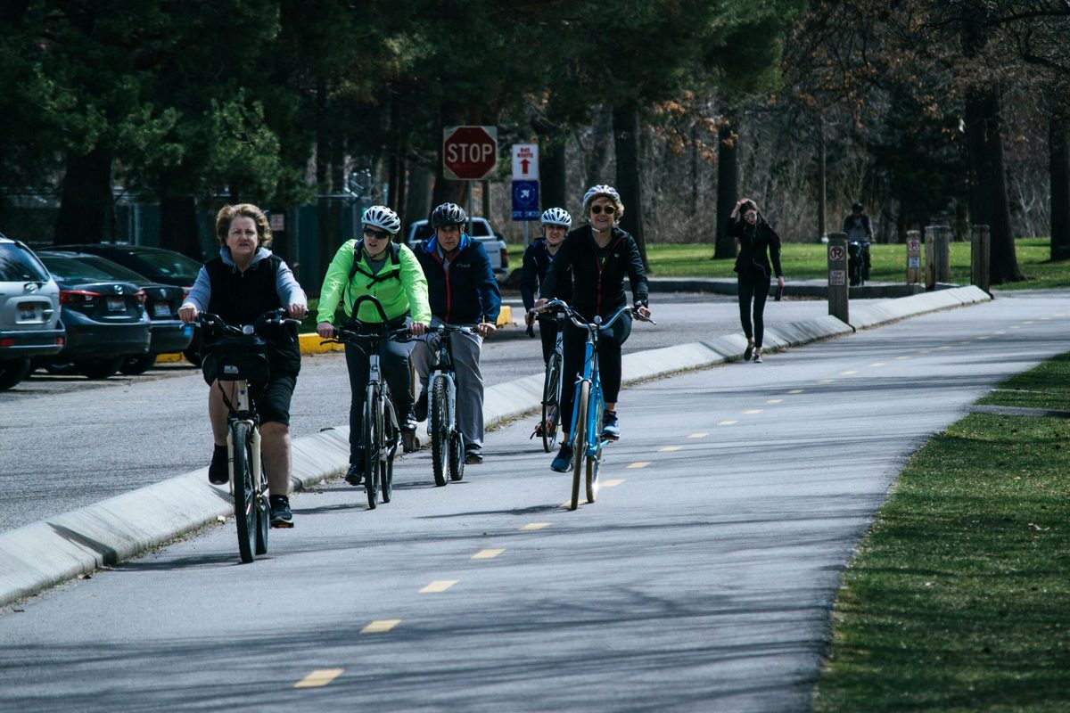 A group of cyclists riding together on a road